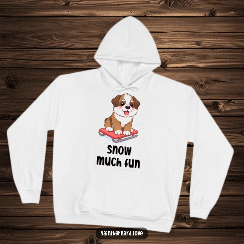 Funny Hoodie depicting a fluffy Saint Bernard pup with rosy cheeks, enjoying a snowy sled ride down a hill, perfect for winter comfort.